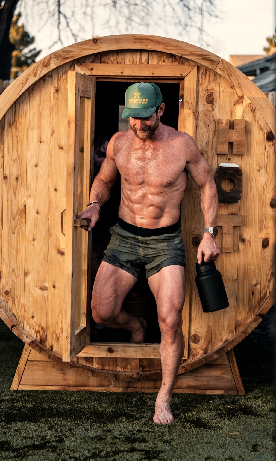 Athlete stepping out of a wooden sauna