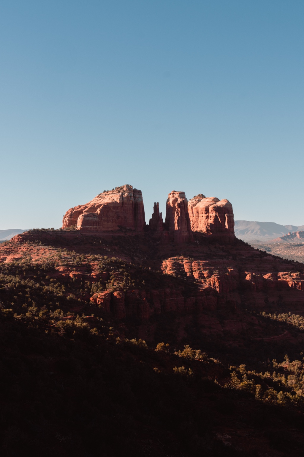 Red rock formation under open sky