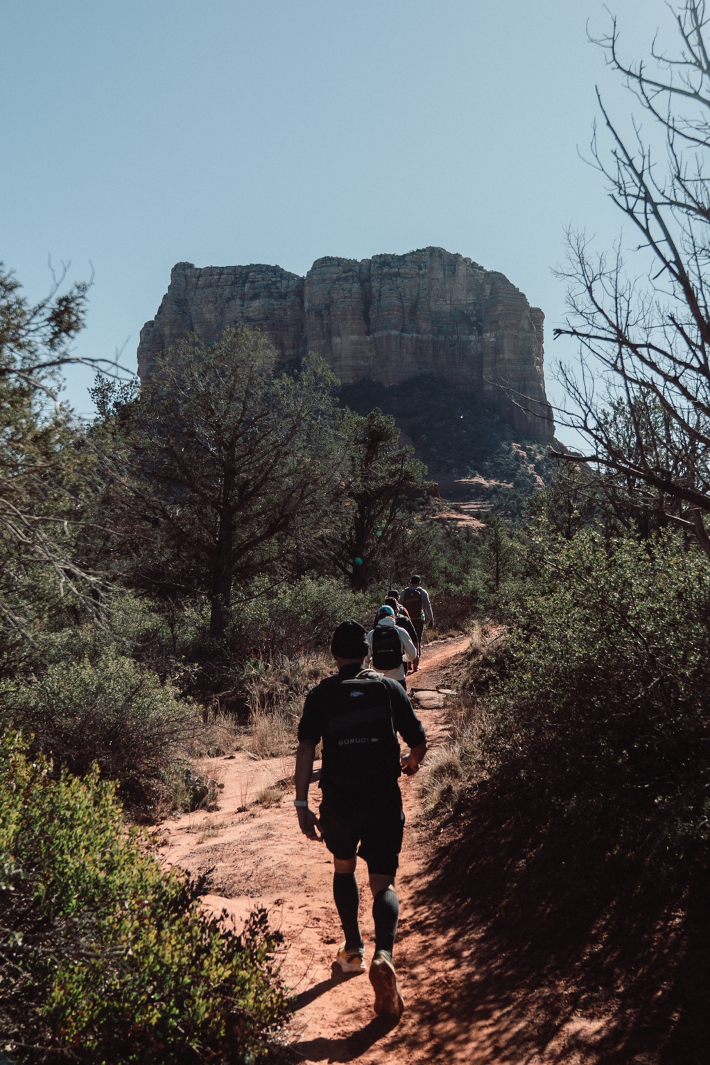 Group moving together along a desert trail